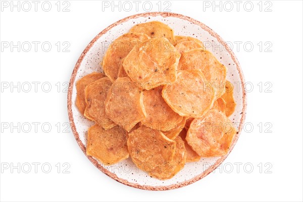 Slices of dehydrated salted meat chips isolated on white background. Top view, flat lay, close up