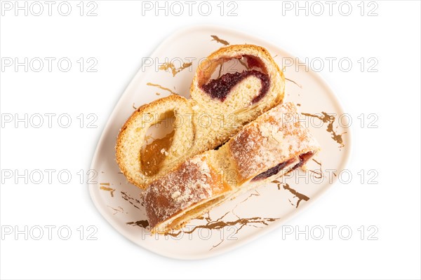 Homemade sweet bun with apricot jam isolated on white background. top view, flat lay