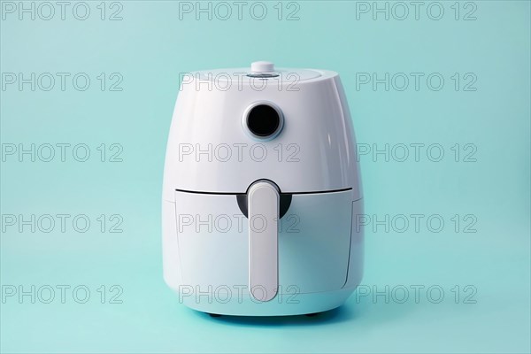 Air fryer on blu ebakcground. KI generiert, generiert AI generated