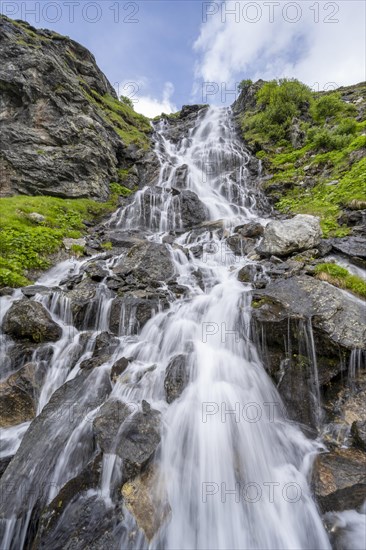 Waterfall on a mountainside, long exposure, Berliner Hoehenweg, Zillertal Alps, Tyrol, Austria, Europe