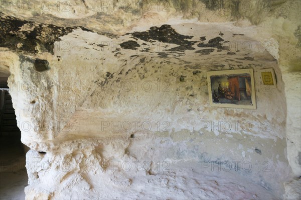 A rock cave with a mural and an information panel, abbot's cell, Aladja Monastery, Aladja Monastery, Aladzha Monastery, medieval rock monastery, cave monastery in the limestone cliff, Varna, Black Sea coast, Bulgaria, Europe