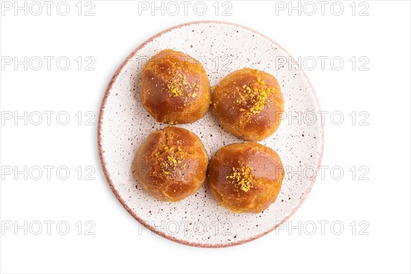 Homemade traditional turkish dessert sekerpare with almonds and honey isolated on white background. top view, flat lay, close up