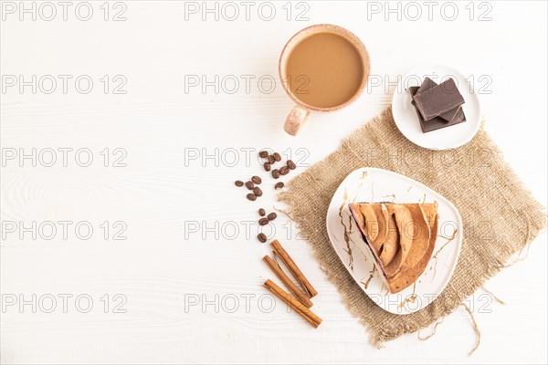 Zephyr or marshmallow cake with cup of coffee on white wooden background and linen textile. top view, flat lay, copy space
