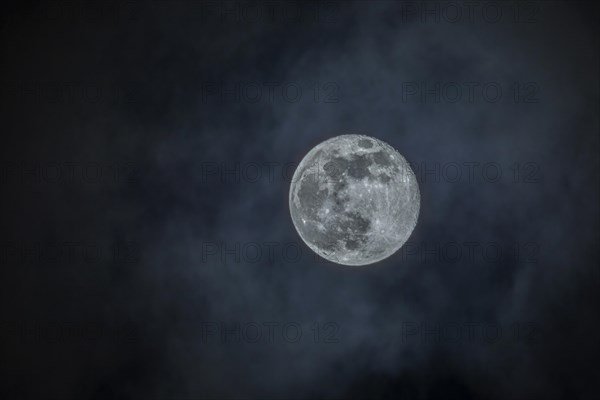Moon, full moon with clouds in the sky, Germany, Europe