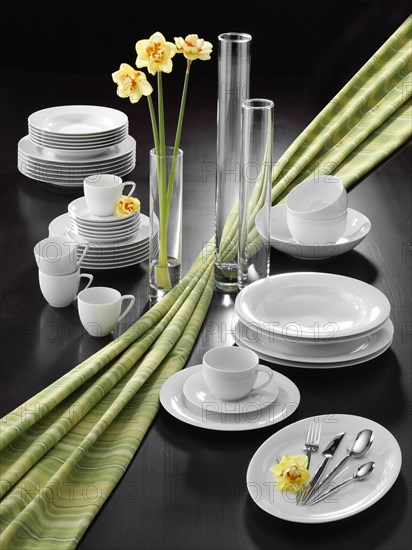 Plates, cups, cutlery, flower vases, table decorations