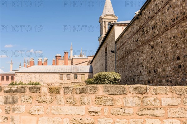 Exterior of mosque with spire against blue sky in Istanbul, Turkiye