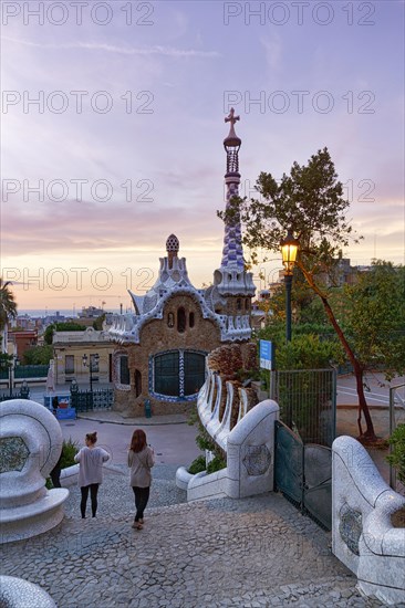 View from the dragon staircase of buildings with colourful mosaics, Park Güell entrance, dawn, Barcelona, Spain, Europe