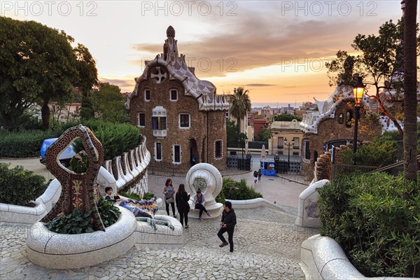 View from the dragon staircase of buildings with colourful mosaics, Park Güell entrance, dawn, Barcelona, Spain, Europe