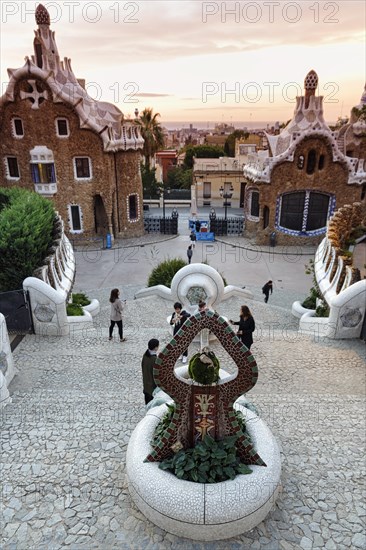 View from the dragon staircase of buildings with colourful mosaics, Park Güell entrance, dawn, Barcelona, Spain, Europe