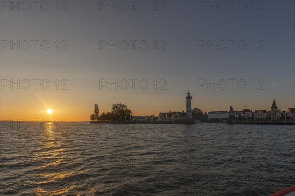 Lindau at Lake Constance, townscape, new lighthouse, entrance to the harbour, evening sun, Bavaria, Germany, Europe