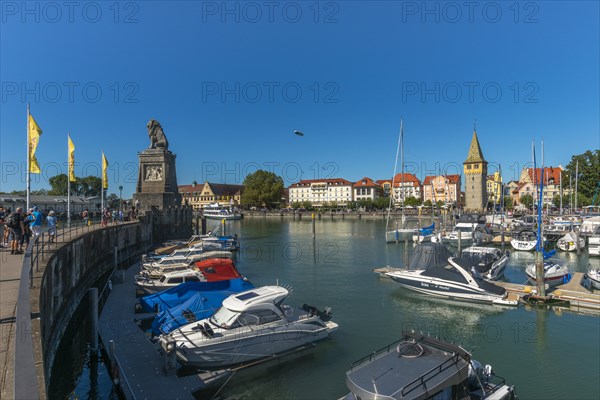 Lindau on Lake Constance, zeppelin, seaport, Bavarian lion, holidaymaker, marina, man tower, Bavaria, Germany, Europe