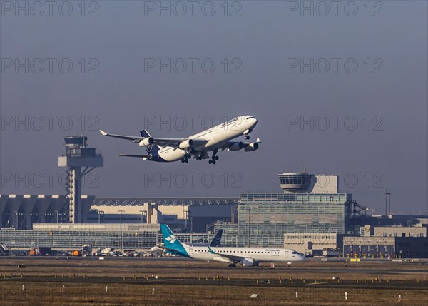 Aircraft taking off at Frankfurt Airport, Fraport Airport with tower. D-AIGL, LUFTHANSA, AIRBUS A340-313, Frankfurt am Main, Hesse, Germany, Europe