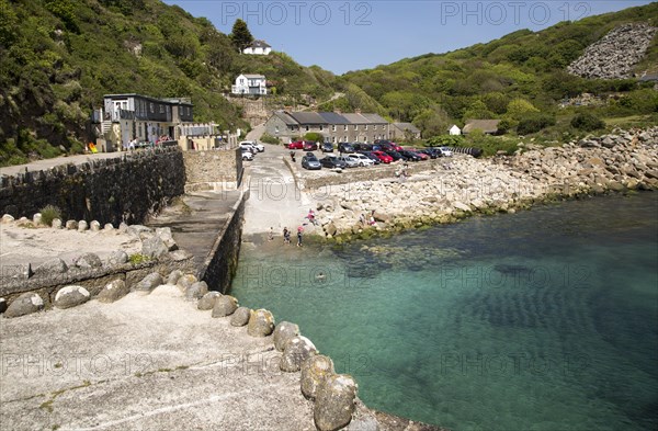 Warm summer sunshine calm water, Lamorna Cove, Cornwall, England, UK