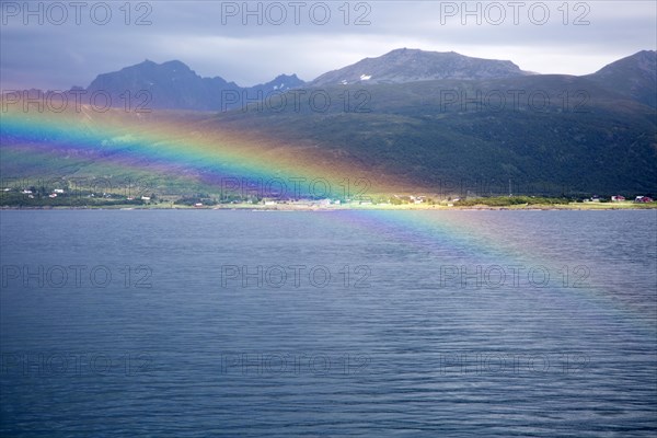 Rainbow over sea near Stokmarknes, Hadsel municipality, Hadseloya island, Nordland, Vesteralen region, northern Norway