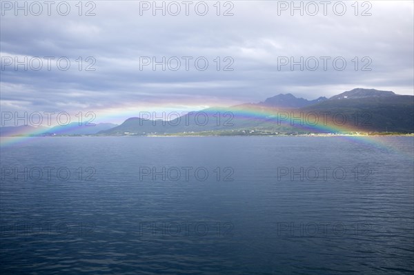 Rainbow over sea near Stokmarknes, Hadsel municipality, Hadseloya island, Nordland, Vesteralen region, northern Norway