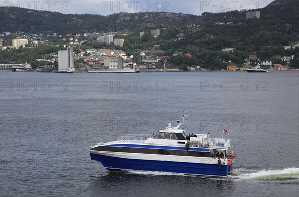 Fast small water taxi ferry boat service in city of Bergen, Norway, Europe