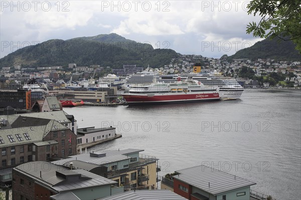 Fjordline ferry ship and cruise ship in docks, city of Bergen, Norway, Europe