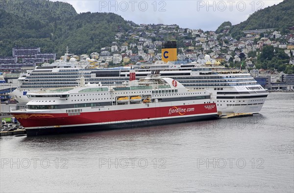 Fjordline ferry ship and cruise ship in docks, city of Bergen, Norway, Europe