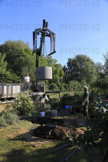 Delivery and installation of concrete ring for domestic septic tank system, Suffolk, England, UK