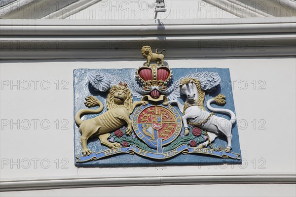 Lion and unicorn royal coat of arms 'Dieu et mon Droit' motto of monarchy seen in Falmouth, Cornwall, England, UK
