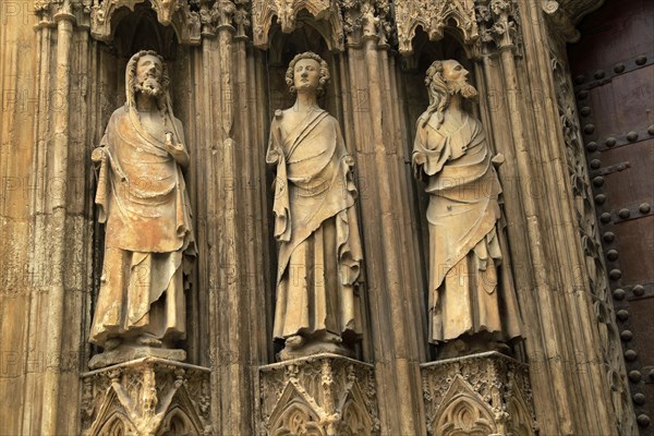 Statues of Christian saints carved stonework of the cathedral church in city of Valencia, Spain, Europe