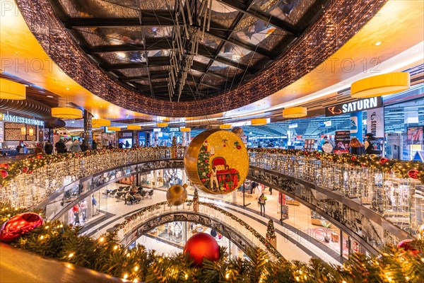 View of the multi-storey interior of a shopping centre, decorated with Christmas decorations, Berlin, Germany, Europe