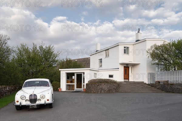 Jaguar and house of Nobel Prize winner Halldor Laxness, Gljúfrasteinn-Laxness Museum, Mosfellsdalur, Iceland, Europe