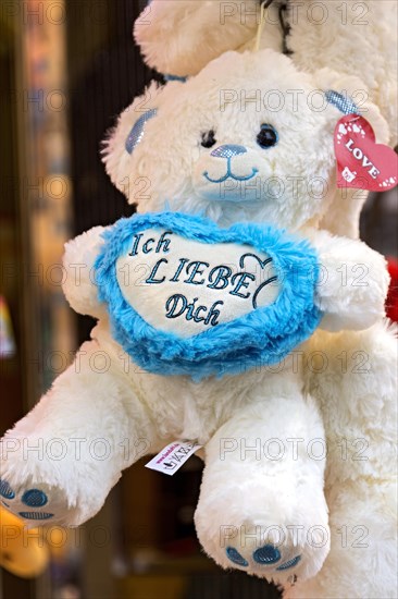 Teddy bear, plush toy with heart, light blue, I love you, prizes, raffle prizes, lucky draw, lottery stand, lottery booth at Kalter Markt, Kaale Määrt, fair, funfair, fairground, Ortenberg, Wetterau, Hesse, Germany, Europe