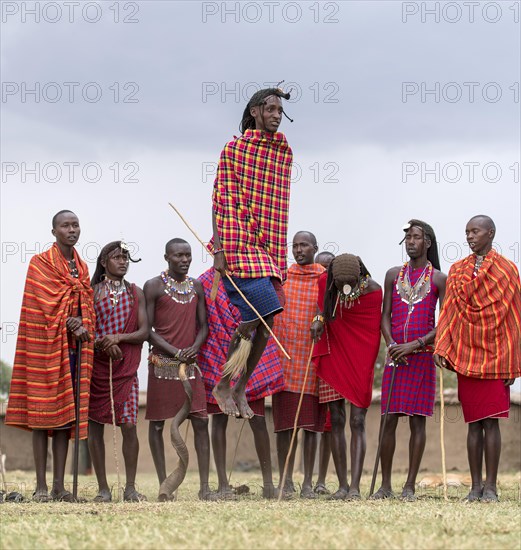 Maasai people preforming the traditional jumping dance in a Maasai village in Maasai Mara, Kenya, Africa