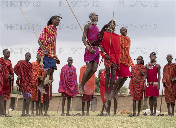 Maasai people preforming the traditional jumping dance in a Maasai village in Maasai Mara, Kenya, Africa
