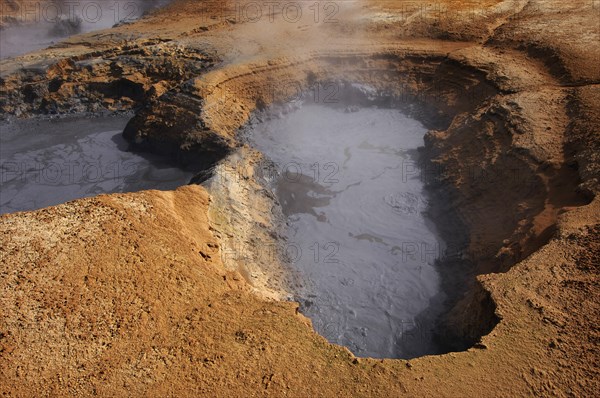 Boiling mud-pool in a geothermal landscape at Hverarond near Myvatn, north Iceland