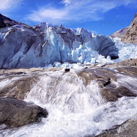 A vigourous melt-water stream issuing from the snout of the Nigardsbreen glacier, Jostedal National Park, Norway, Europe