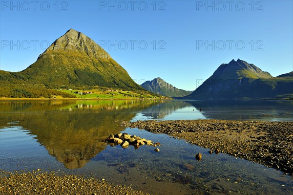 The island of Aldra with the Hjarttinden and Liatinden peaks from the shore at Haugland, north-west Norway