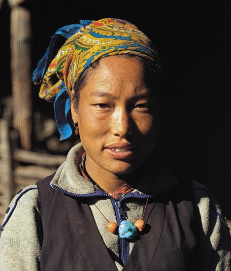 Portrait of pretty Bhotia girl with headscarf at the village of Chhinga in the Mustang region of west Nepal