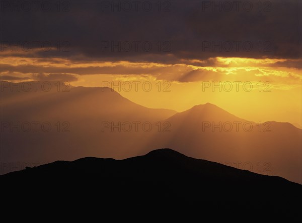 Sunrise over ridges of foothills at Ghul Bhanjyang in the Helambu region of central Nepal