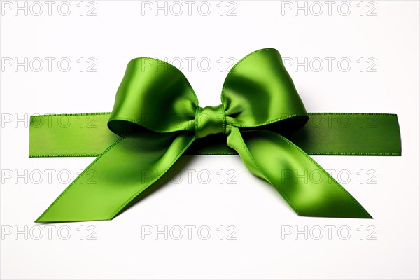 Green silk ribbon on white background. KI generiert, generiert AI generated