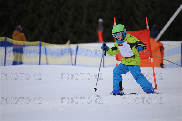 Child at a guest ski race in a ski resort