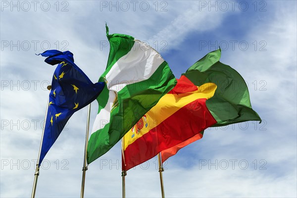 Four flags next to each other, fluttering in the wind, strong wind, European Union, Andalusia, Spain, Granada, Alhambra, Spain, Europe