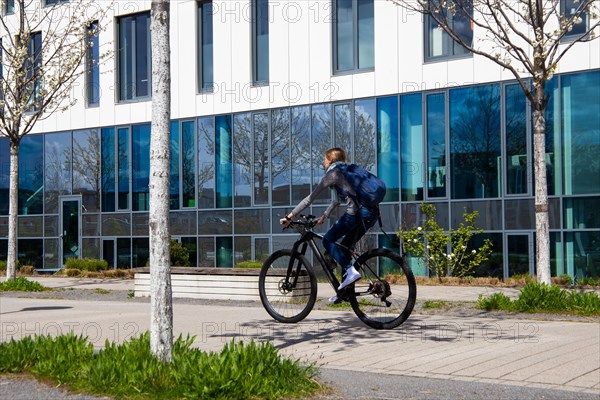 Young woman with bicycle in the city