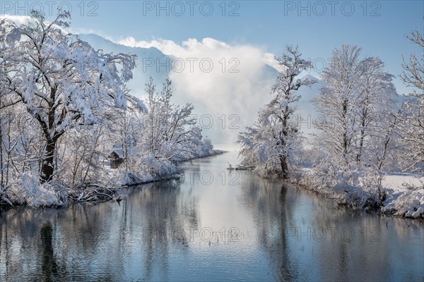 Winter landscape with outflow of the Loisach from the Lake Kochel in front of the Herzogstand 1731m, Kochel am See, Das Blaue Land, Bavarian Alps, Upper Bavaria. Bavaria, Germany, Europe