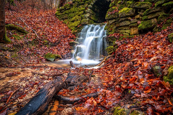 Waterfall in the Rautal forest in Jena in winter, Jena, Thuringia, Germany, Europe