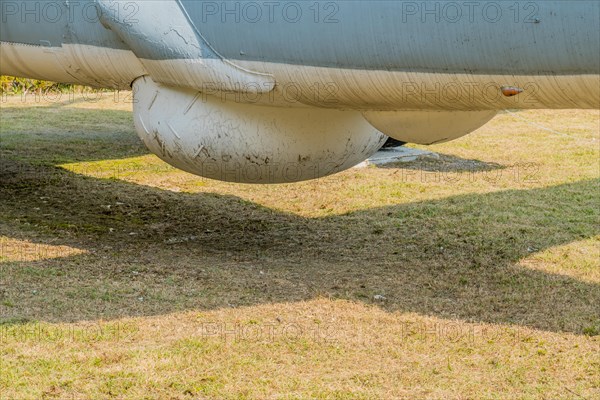 Sensor dome on bottom of military tracker aircraft on display in public park