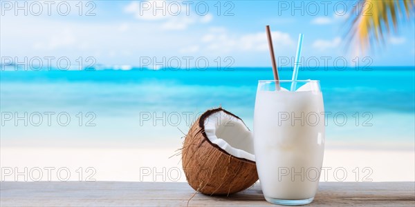 Tropical cocktail with drinking straws and coconut with beach in background. KI generiert, generiert AI generated
