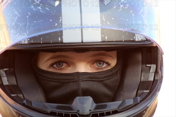 Racer with helmet and balaclava