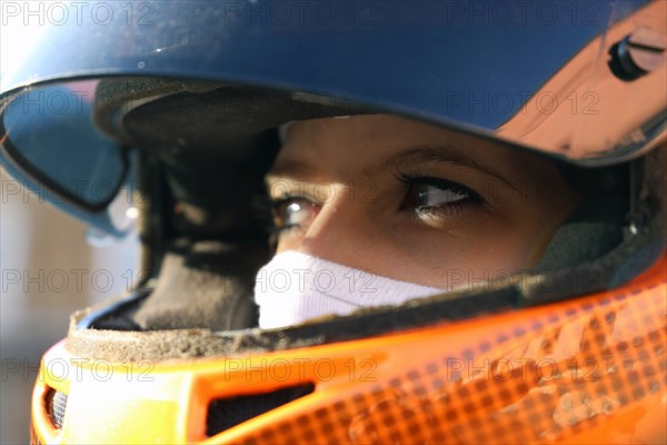 Symbolic image: Racer with helmet and balaclava