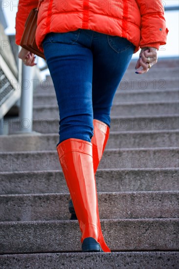 Woman with red rubber boots