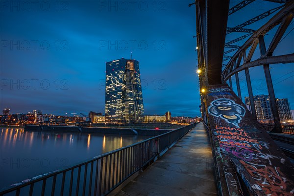 The lights of the European Central Bank (ECB) in Frankfurt am Main shine in the evening, Osthafen, Frankfurt am Main, Hesse, Germany, Europe