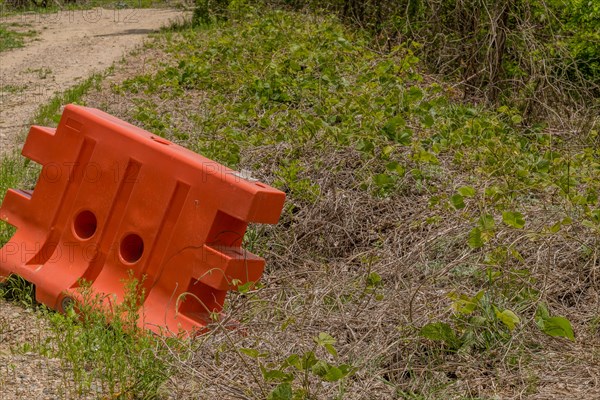 Orange plastic traffic barrier in remote wilderness area in South Korea