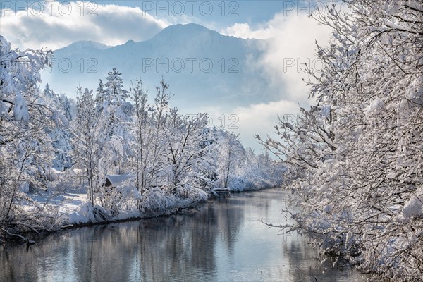 Winter landscape with outflow of the Loisach from the Lake Kochel in front of the Herzogstand 1731m, Kochel am See, Das Blaue Land, Bavarian Alps, Upper Bavaria. Bavaria, Germany, Europe