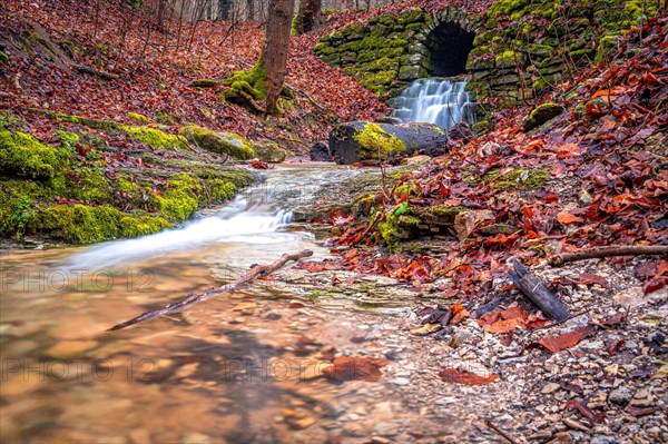 Waterfall in the Rautal forest in Jena in winter, Jena, Thuringia, Germany, Europe